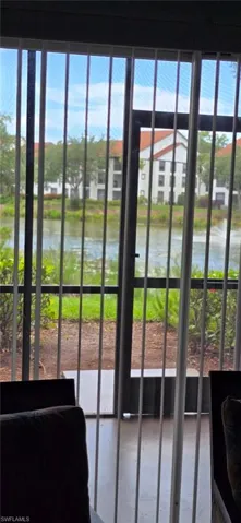 Doorway to outside featuring a water view
