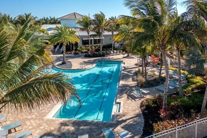 Community pool with a patio