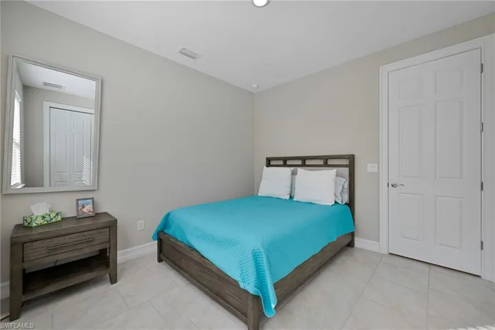 Bedroom featuring light tile patterned flooring
