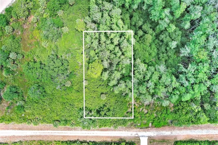Aerial view of property's location featuring property parcel outlined