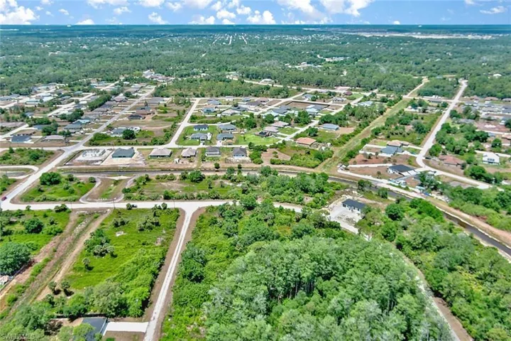 Aerial overview of property's location with nearby suburban area