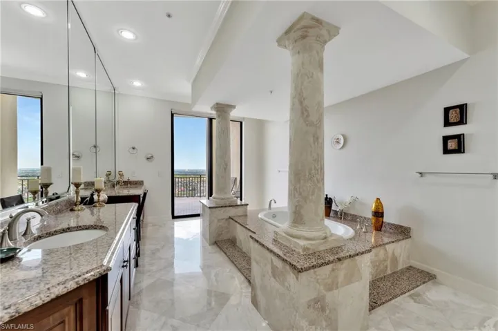 Spacious Master Bath with jetted tub, double vanity, walk in shower and 2 walk in closets