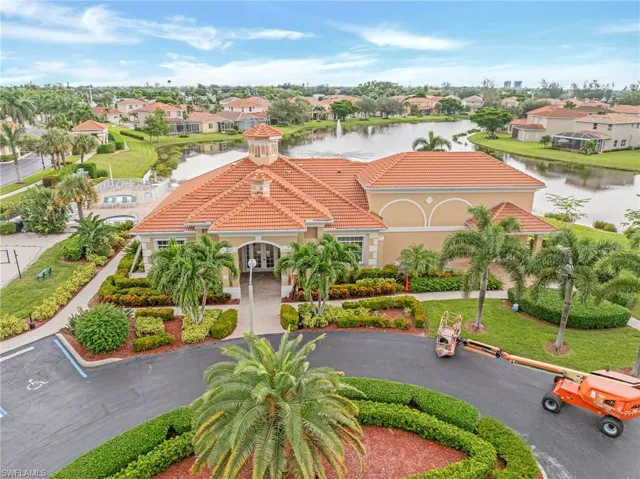 Aerial view of residential area featuring a large body of water