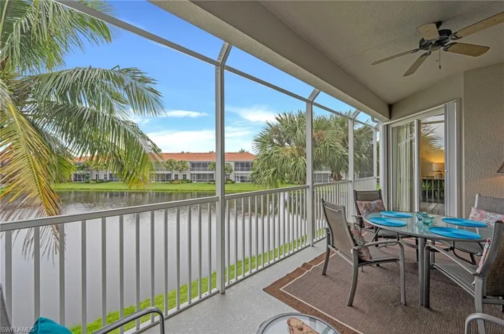 Balcony with a water view and outdoor dining space
