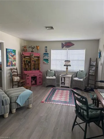 Living room featuring open space and wood finished floors