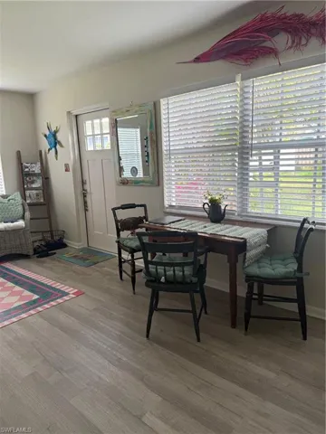 Dining space featuring a healthy amount of sunlight, , and wood finished floors