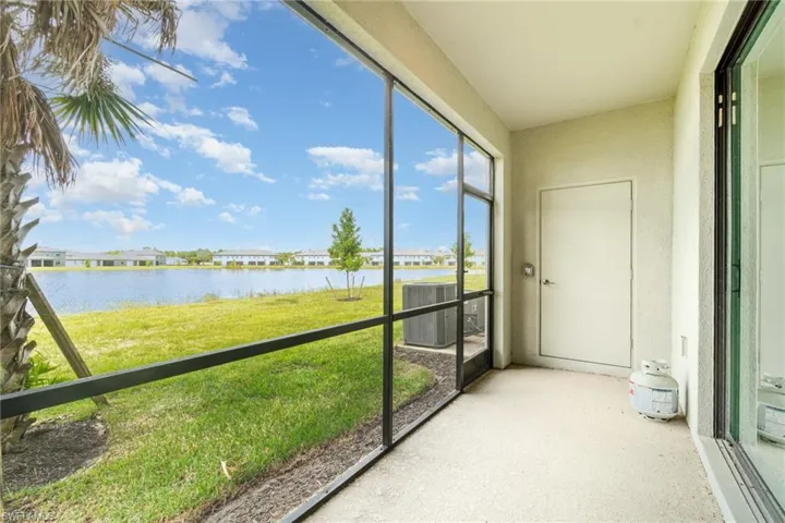Unfurnished sunroom with a water view