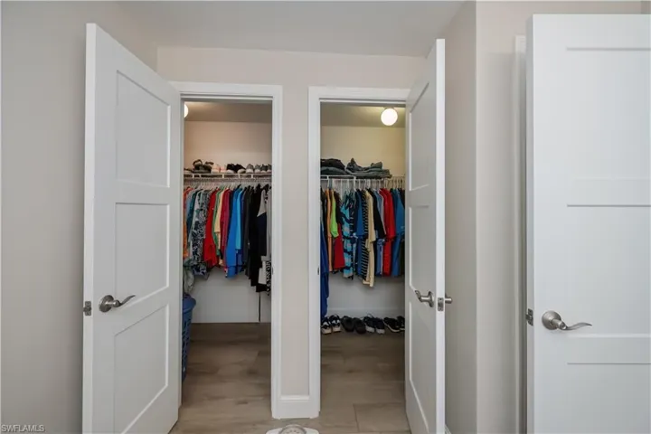 View of his and hers walk-in closets