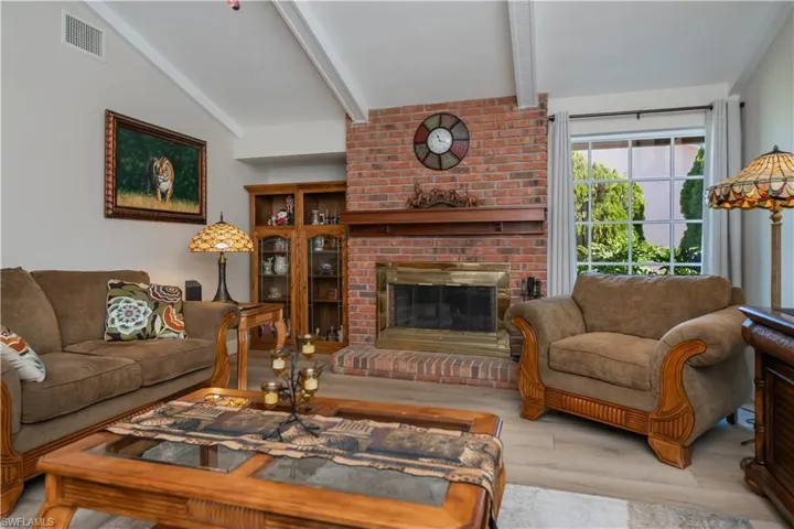 Living room featuring wood finished floors and a fireplace
