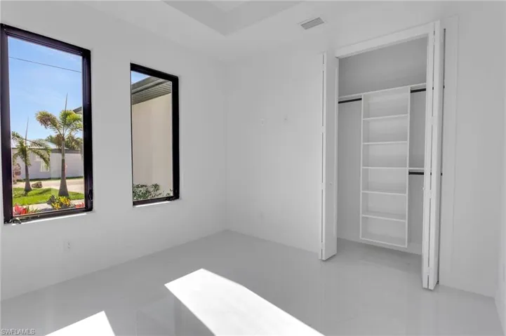 Bathroom with a freestanding bath, a marble finish shower, vanity, and recessed lighting