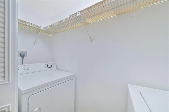 Laundry area with washing machine and clothes dryer