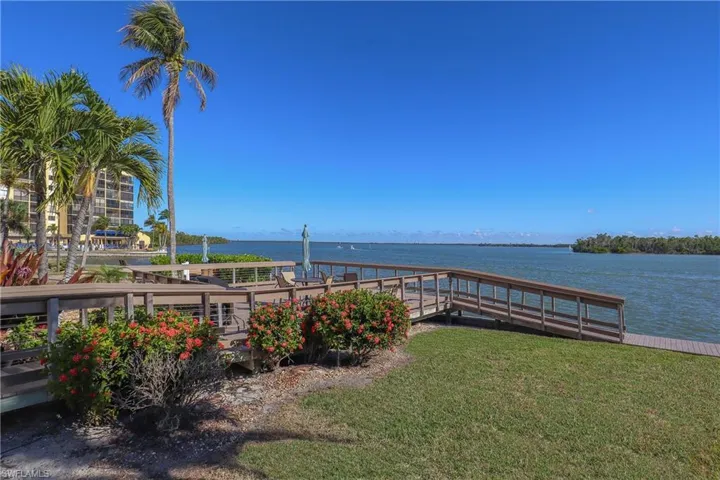 Dock featuring a water view of Estero Bay