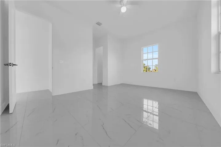 Empty room featuring a ceiling fan