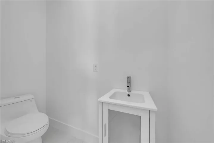 Bathroom featuring vanity and baseboards