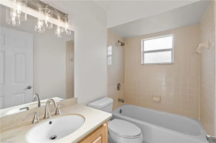 New paint, faucet, mirror & light fixture