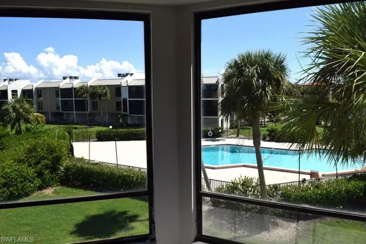 View of swimming pool with a yard