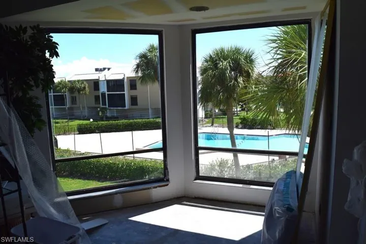 View of pool through bay windows.