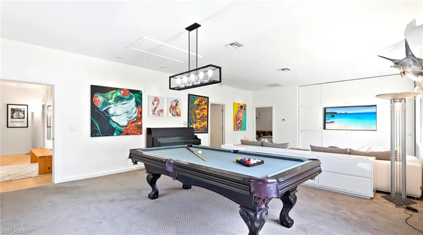 Rec room featuring billiards table, light carpet, and attic access