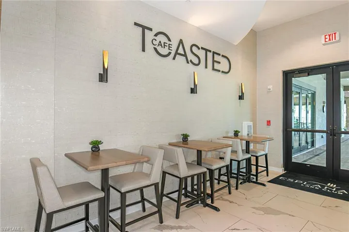 Dining area featuring tile walls and french doors