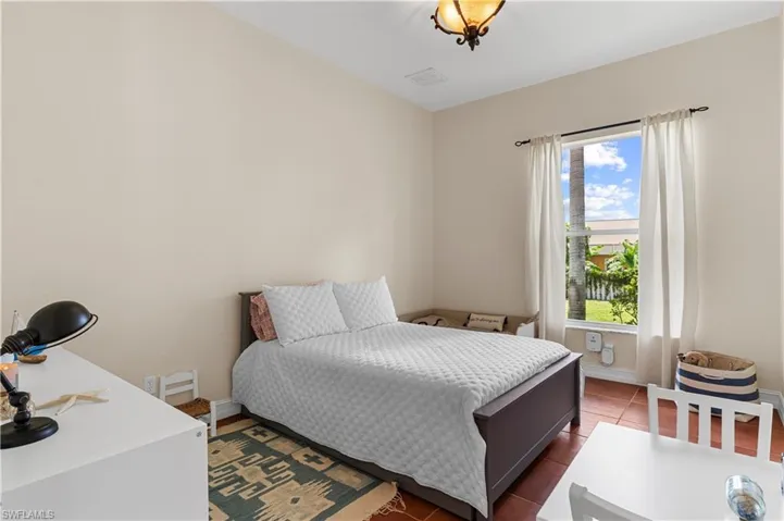 Bedroom featuring a closet and tile patterned floors