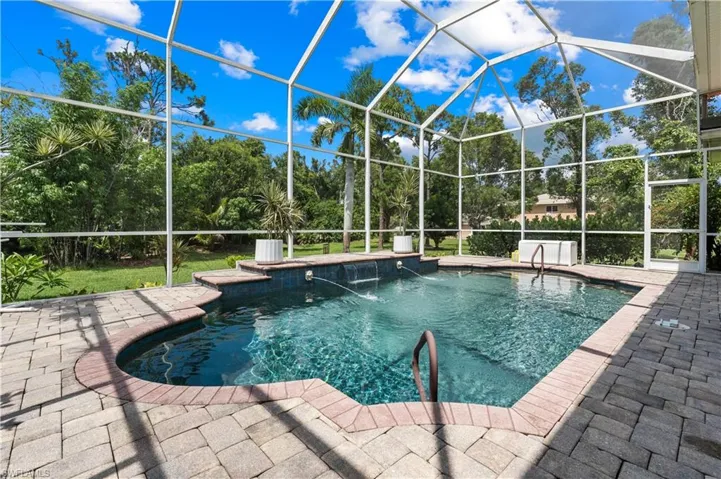 View of patio with an outdoor pool, a lanai, a ceiling fan, and outdoor dining area