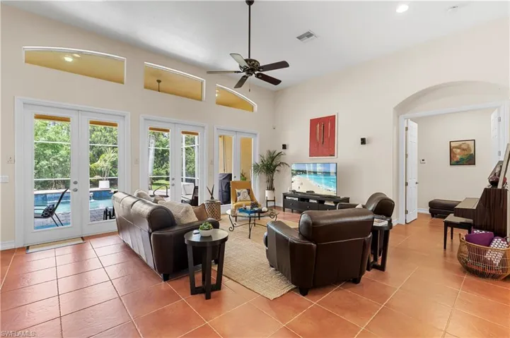 Home office with wood finished floors and a chandelier