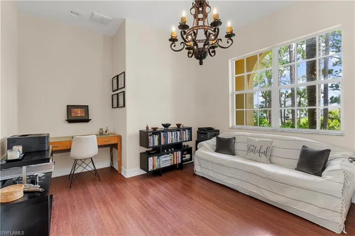 Kitchen with decorative columns, appliances with stainless steel finishes, ceiling fan, light tile patterned floors, and recessed lighting