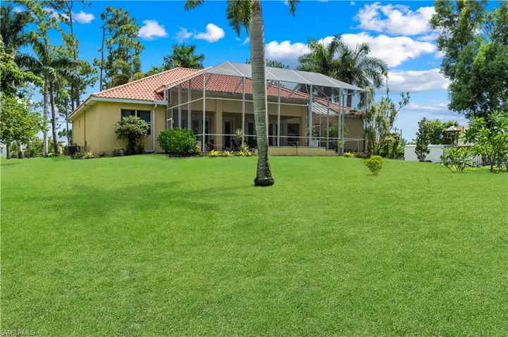 Outdoor pool featuring french doors, a patio, and a lanai