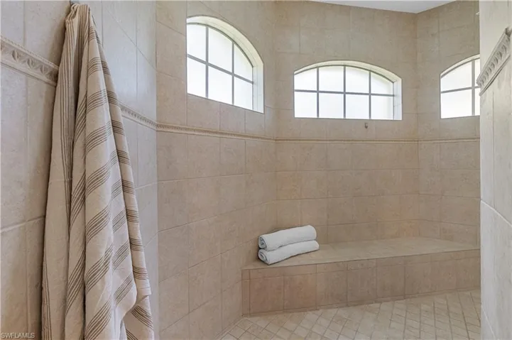 Full bath featuring a garden tub, tile patterned flooring, vanity, and walk in shower