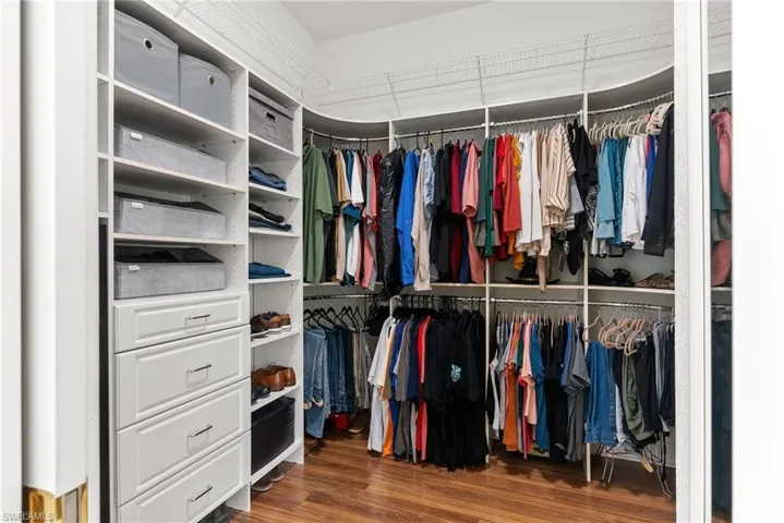 Huge Walk In Closet with Cabinets and Organizational Design-Primary Bedroom