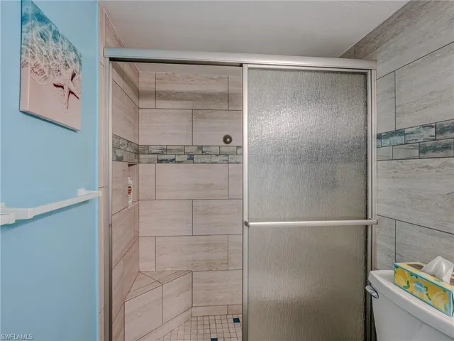 Bathroom featuring toilet and walk in shower