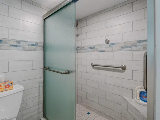 Bathroom with an enclosed shower and toilet