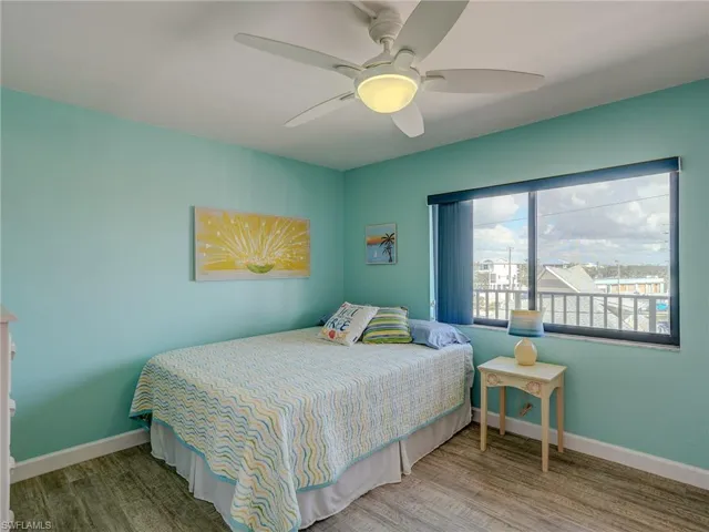 Bedroom with wood-type flooring and ceiling fan