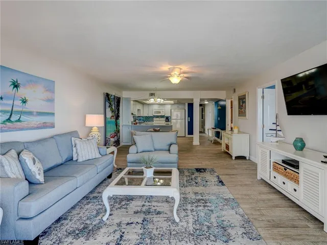 Living room featuring a notable chandelier and light hardwood / wood-style floors
