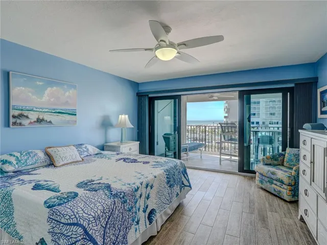 Bedroom featuring a textured ceiling, access to exterior, ceiling fan, and light hardwood / wood-style flooring