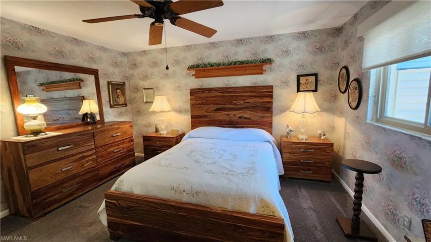 Carpeted bedroom with ceiling fan