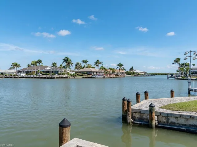 Dock featuring a water view and a residential view