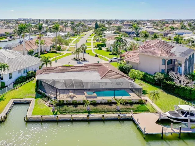 Aerial perspective of suburban area with a nearby body of water