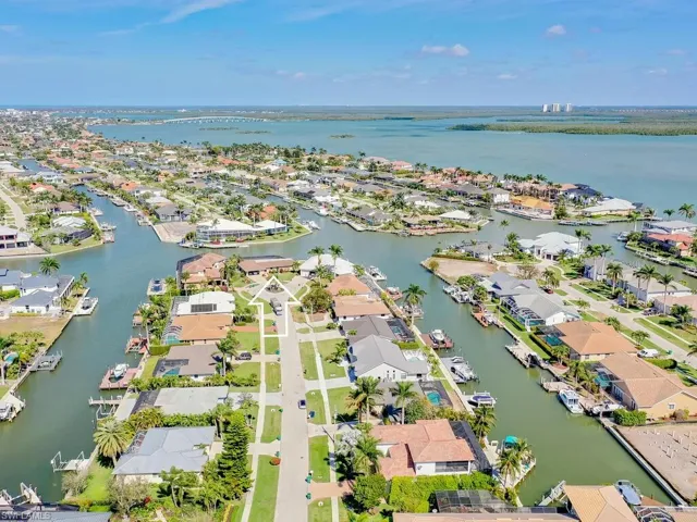 View of property location with nearby suburban area and a nearby body of water