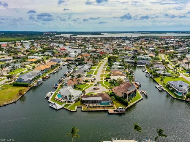 Aerial view of residential area with a large body of water