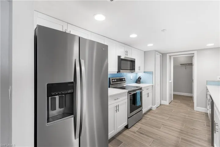 New Stainless Appliance, New Shaker Cabinets and the new tile flooring throughout.  A very nice updated clean, refreshing look.