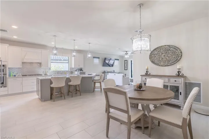 Dining room with heating unit and ceiling fan