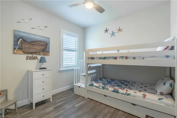 Bedroom featuring hardwood / wood-style floors and ceiling fan