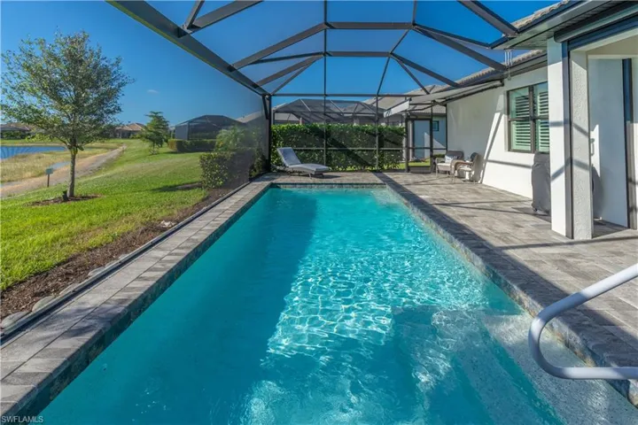 View of pool featuring a patio and a lanai