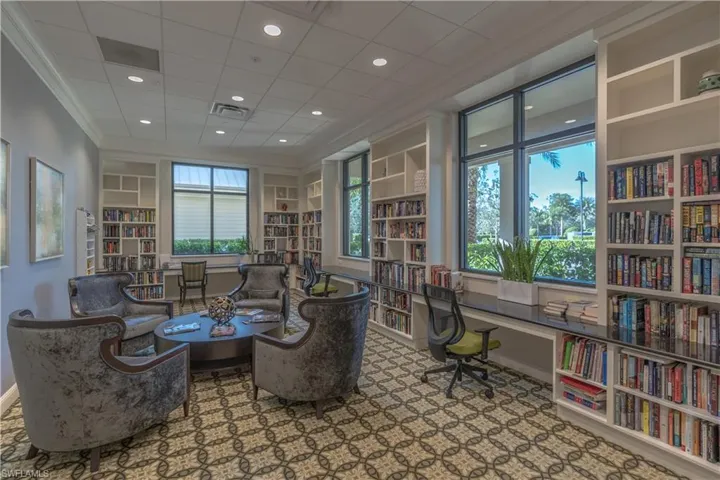 Office featuring built in features and crown molding