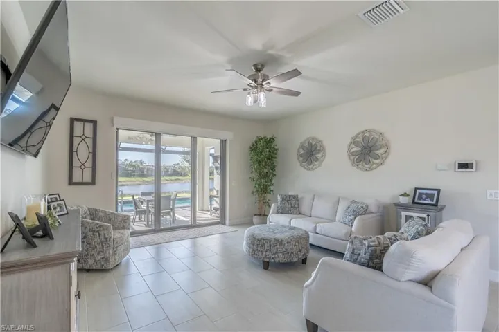 Living room featuring ceiling fan