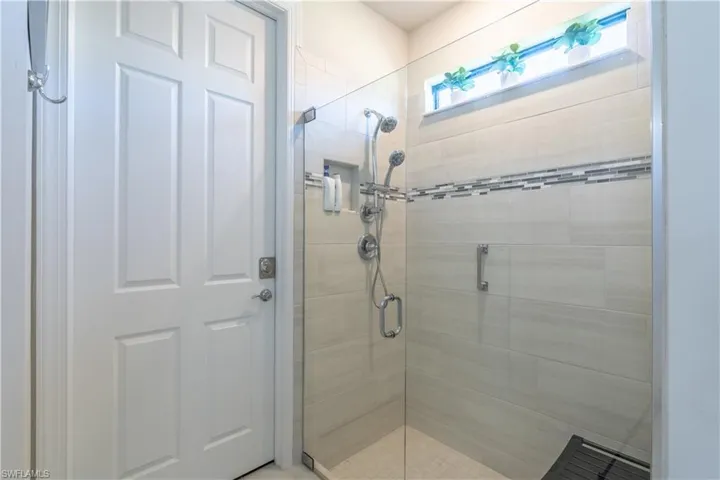 Bathroom with a shower with shower door