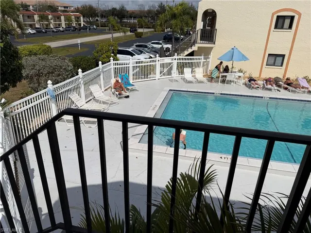 Community pool featuring a patio