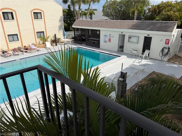 Community pool with a patio