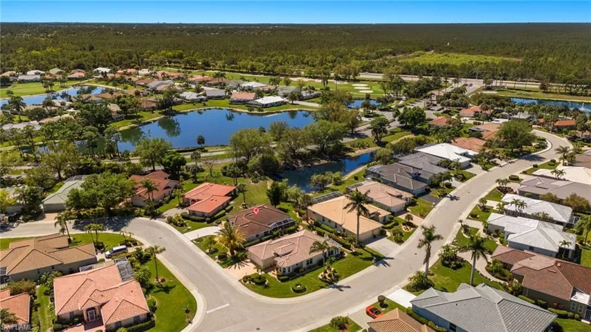 Birds eye view of property featuring a residential view, a forest view, and a water view